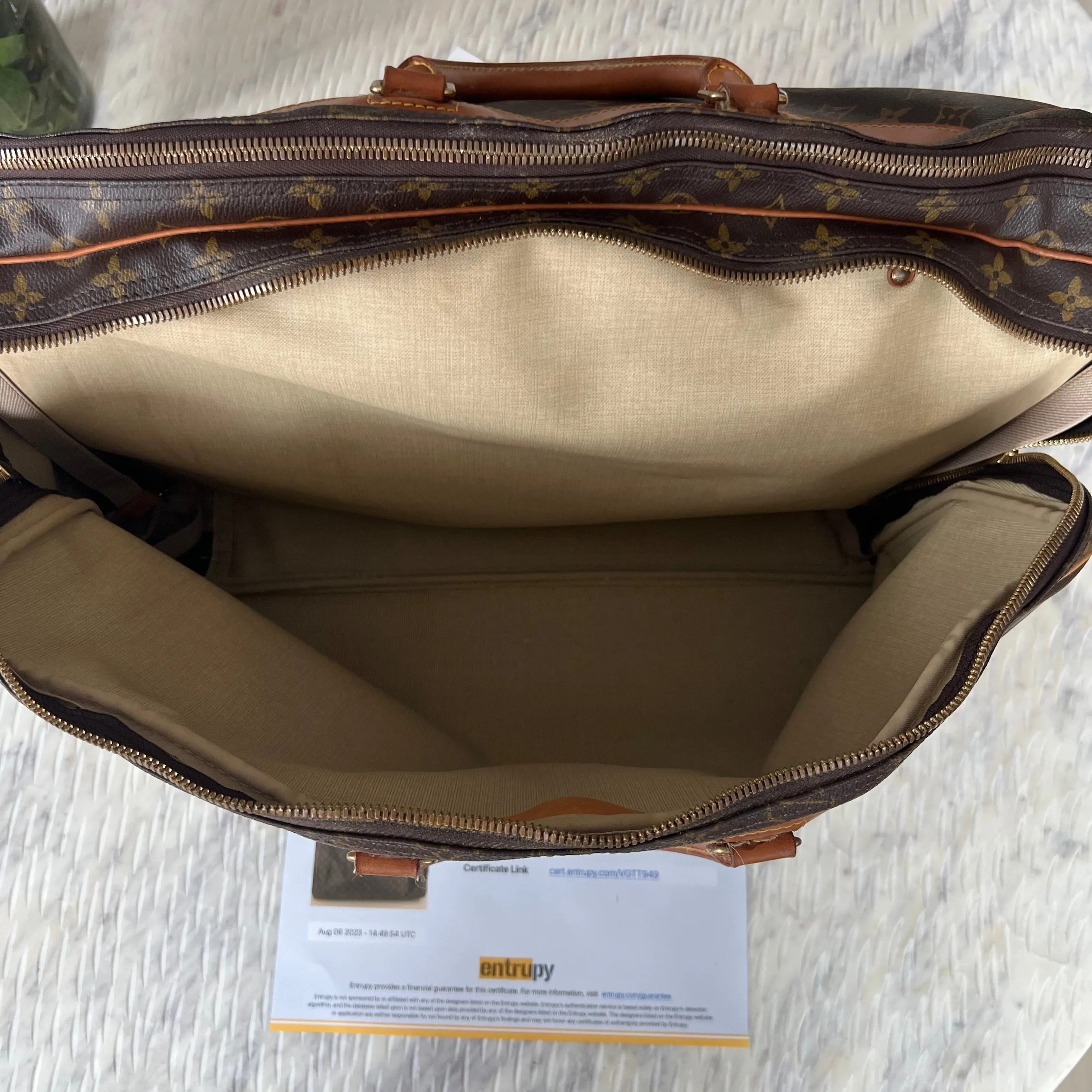 Louis Vuitton Alize Heures 24 Bag