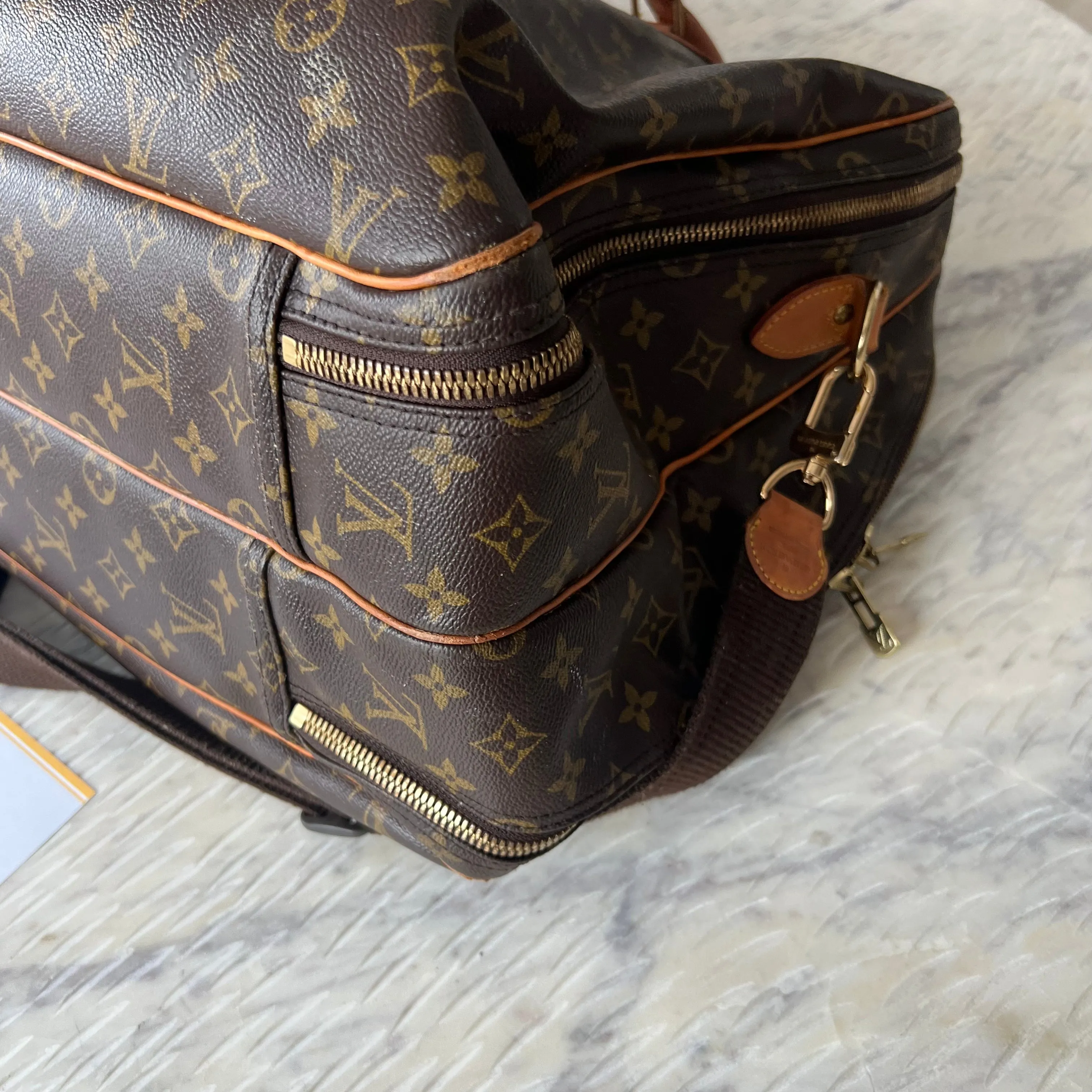 Louis Vuitton Alize Heures 24 Bag