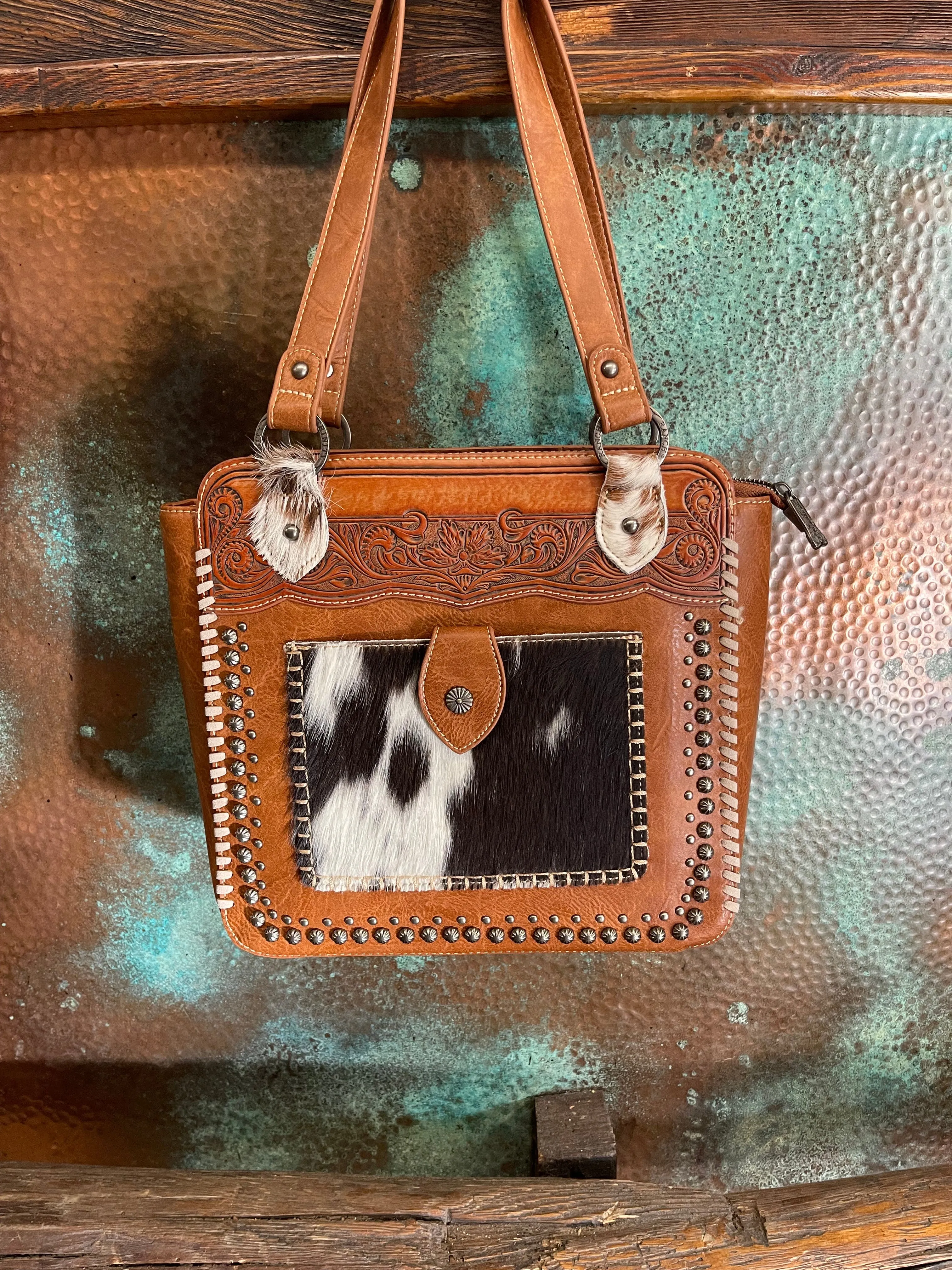 The San Pueblo tooled cowhide handbag